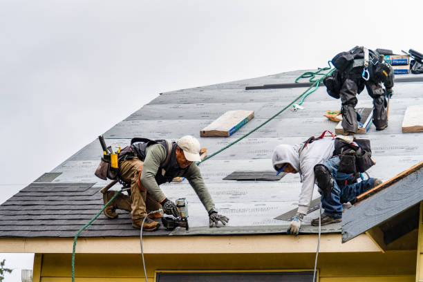 Professional Storm Damage Roof Repair technician working in Yukon, OK